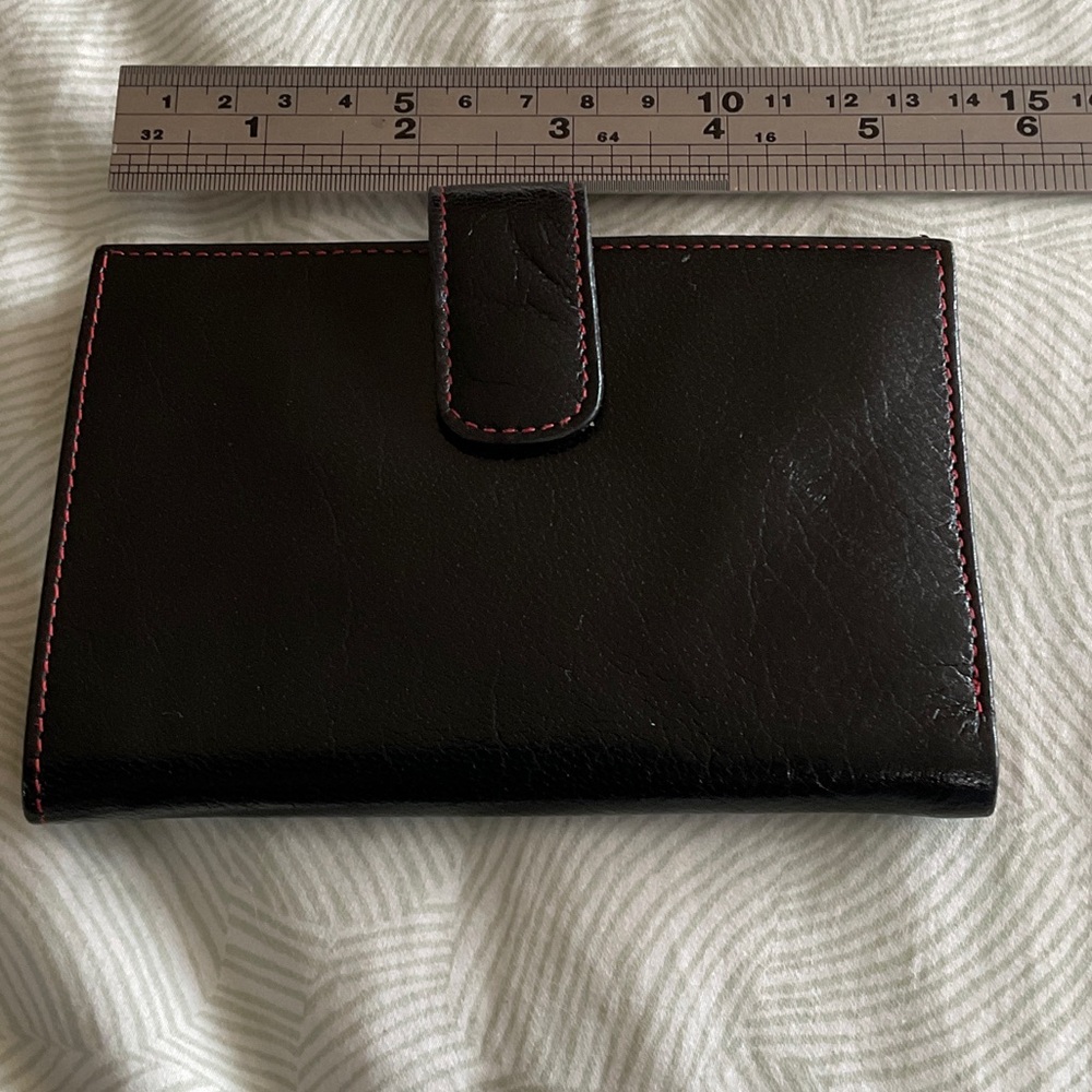 Black leather Tusk wallet.
